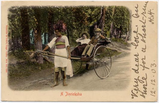 postcard showing rickshaw held by Indian with white couple seated